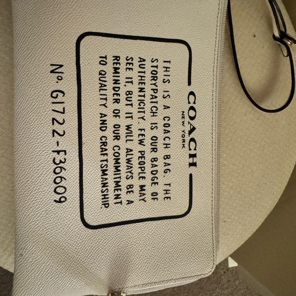 Coach Cream Leather Wristlet with Black Accents